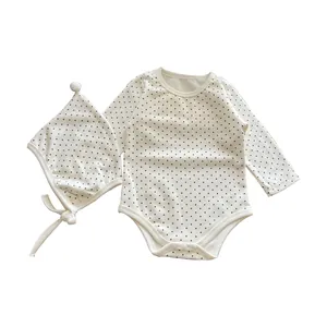 Baby polka dot long sleeve romper with matching hat set in soft cream cotton fabric