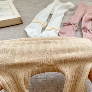 Close-up of baby ribbed tights with double-stitch crotch and cute bow detail