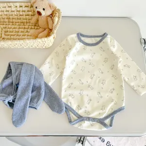 Detail of baby bunny print long sleeve romper with matching rabbit ear knit hat