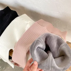 Detailed view of fleece lining and ribbed texture on warm winter leggings for babies