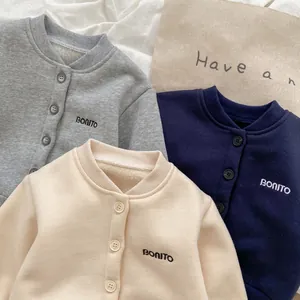 Detailed view of fleece lined cotton sweatshirts with Bonito embroidery in neutral colors