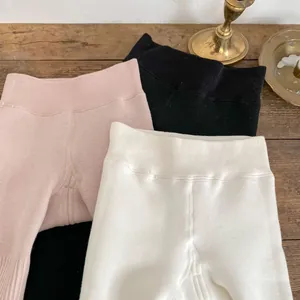 Detail of high-waist ribbed waistband on thick fleece lined leggings for baby girls