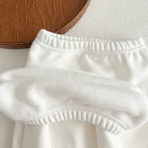 Detail of baby winter pants featuring a warm fleece lining and elastic waistband