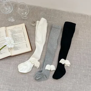 Detailed knit texture of baby leggings with cute 3D angel wings decoration
