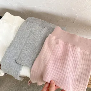Detailed texture of thick ribbed knit winter leggings for baby girls in three colors