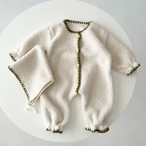 Infant winter fleece romper with matching hat featuring green crochet trim and wood buttons
