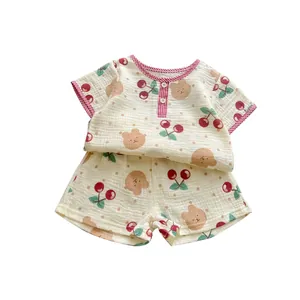 Infant cotton gauze set featuring cute bear and cherry prints with red checkered edging