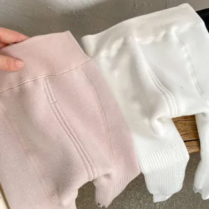 Detail of high-elastic waist and vertical knit texture on thick baby winter leggings