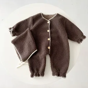 Warm fleece baby jumpsuit set in brown with wooden buttons and matching ear-flap hat