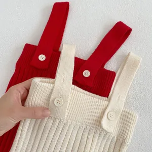 Infant ribbed knit suspender bodysuit in red and cream white with decorative buttons
