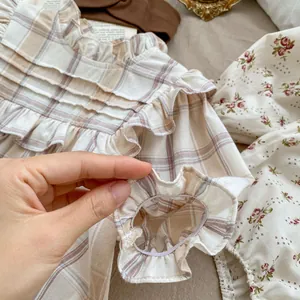 Baby girl floral and plaid long sleeve bodysuit with elastic ruffled cuffs for spring