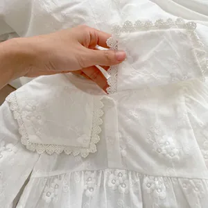 White infant bodysuit with floral embroidery and lace Peter Pan collar in pure cotton