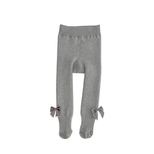 Warm winter gray ribbed leggings for baby girls with cute bow details on the ankles