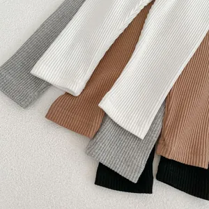 Detail shot of ribbed cotton fabric in grey, white, coffee, and black for baby leggings