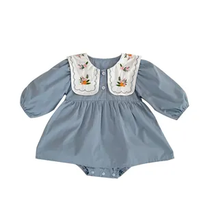 Blue baby girl bodysuit with floral embroidery and white Peter Pan collar
