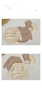 Detail of baby hollow knit romper with ruffled collar and matching bonnet set