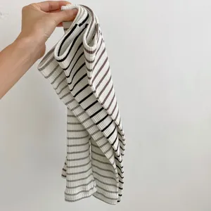 Detail showing ribbed texture and striped patterns of cotton baby leggings in various colors