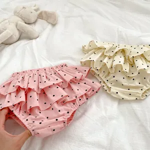 Polka dot infant ruffle bloomer shorts in pink and cream with breathable cotton fabric