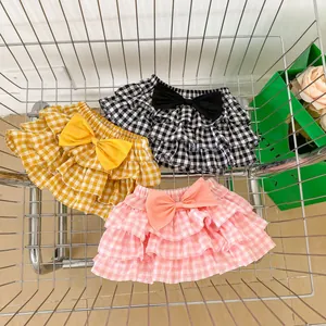 Three-tier ruffle plaid skirts for baby girls with large decorative bow on the waist