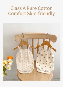 Detail of Class A pure cotton baby romper featuring cute bear and floral patterns