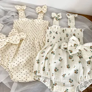 Baby girl summer romper sets with floral and polka dot prints and matching bow headbands