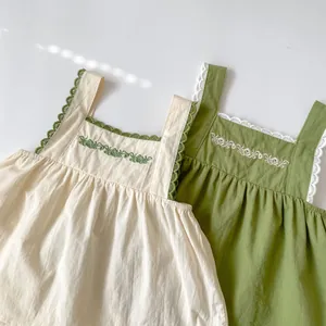 Detailed embroidery and lace trim on baby girl sleeveless cotton tops in white and green