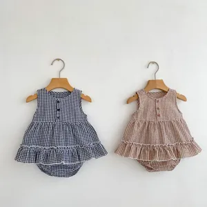 Detail of baby girl plaid sleeveless top and bloomers set in black and brown cotton