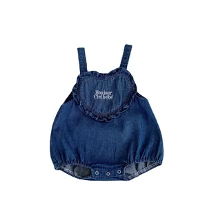 Infant denim romper with heart embroidery and ruffles in deep blue wash style