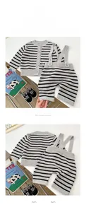 Detail showing grey striped knit cardigan and matching overalls set for infants