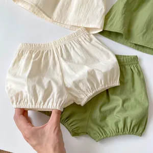 Baby cotton bloomers set in off-white and sage green with elastic waist and leg cuffs