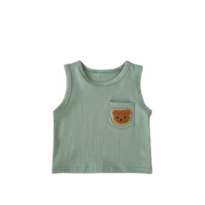 Sage green baby vest set with a cute brown teddy bear patch and soft cotton fabric