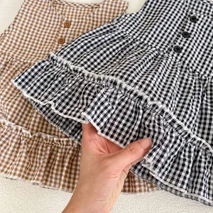 Infant girl plaid ruffle dress set in black and brown checks with button detail