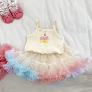 Detail of baby girl cupcake top and colorful layered tulle tutu skirt set