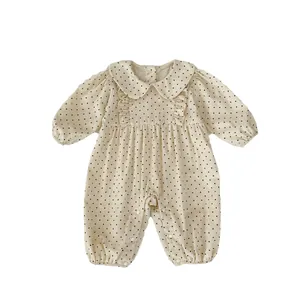 Infant polka dot corduroy romper with Peter Pan collar and ruffled details
