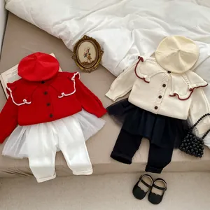Toddler girl knit cardigan with tutu skirt leggings and beret flat lay outfit