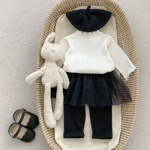 Toddler girl set featuring white ribbed long sleeve top, mesh tutu skirt, pants and beret
