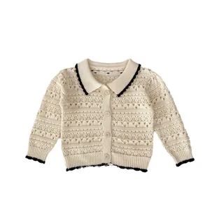 Toddler girl cream openwork knit cardigan with collar and black scalloped trim