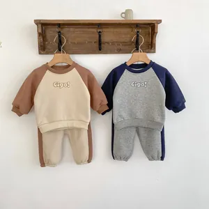 Detail of ribbed cuffs and collar on toddlers fleece sweatshirt and joggers set