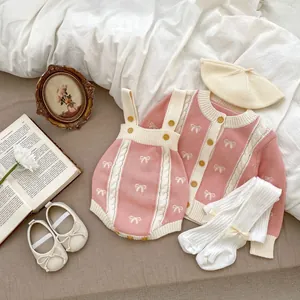 Baby girl pink knit cardigan and romper set with bows, socks, and beret for autumn wear