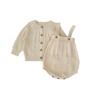 Infant two-piece cream cable knit set with long sleeve cardigan and wooden buttons