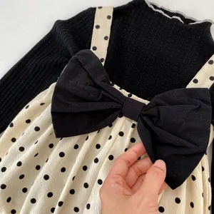 Sweet baby girl set with black knit top and beige polka dot bow strap romper suit