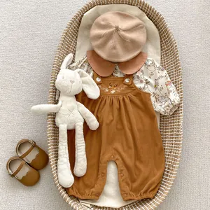 Detailed four-piece infant set with floral shirt, deer jumpsuit, beret, and Mary Jane shoes