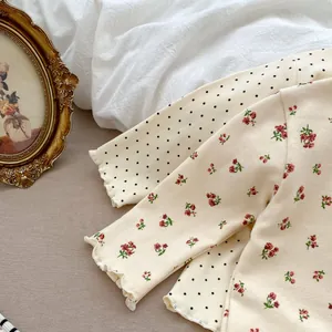 Detail of ruffle cuffs on floral and polka dot girls' cotton long sleeve shirts