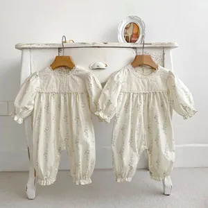 Floral cotton baby rompers with vintage lace details and long sleeves in cream