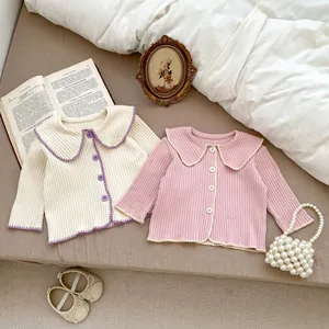 Flachbild von Strickjacken mit Peter-Pan-Kragen in Beige und Rosa für Kleinkinder