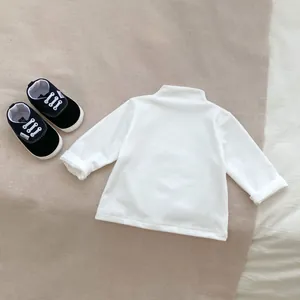 White long-sleeve turtleneck baby bodysuit made of soft cotton for infant base layer