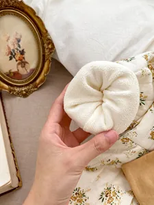 Detail of baby floral romper showing thick fleece lining for warmth and comfort