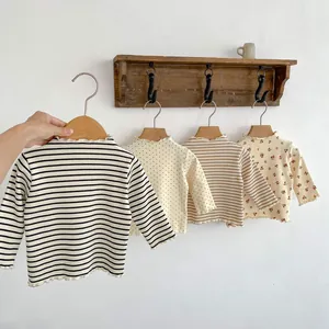 Cotton long sleeve baby t-shirts with ruffle edges in stripes and floral patterns