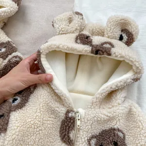 Close-up of baby bear romper showing soft fleece lining and fluffy plush texture