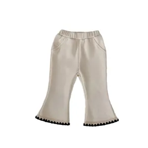 Off-white ribbed flare pants for girls with elastic waist and black wavy hem details